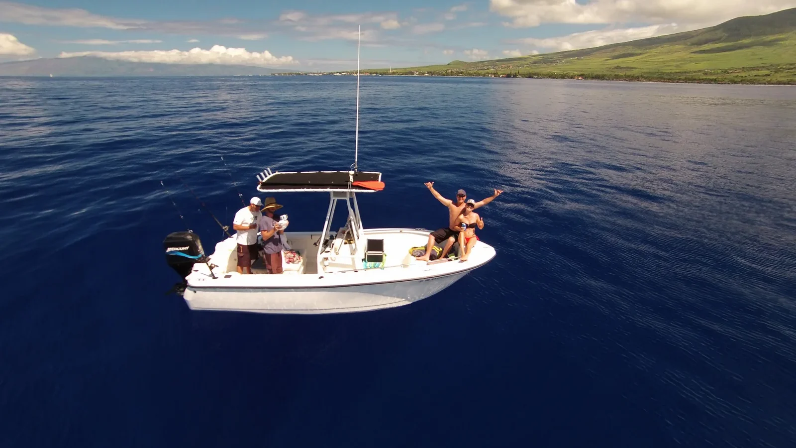 A small fishing boat on deep blue water off West Maui