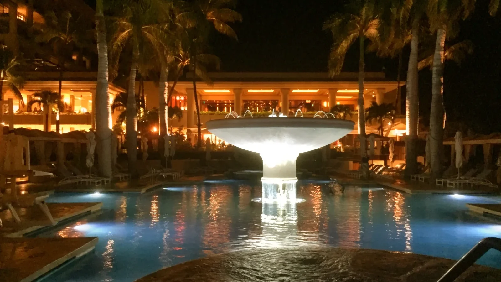 The lit lobby and pool fountain at Four Seasons Resort Maui at Wailea at night
