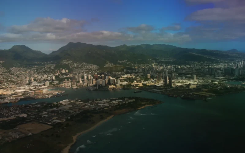 Aerial view of Honolulu neighborhoods and downtown below the Koʻolau Mountains