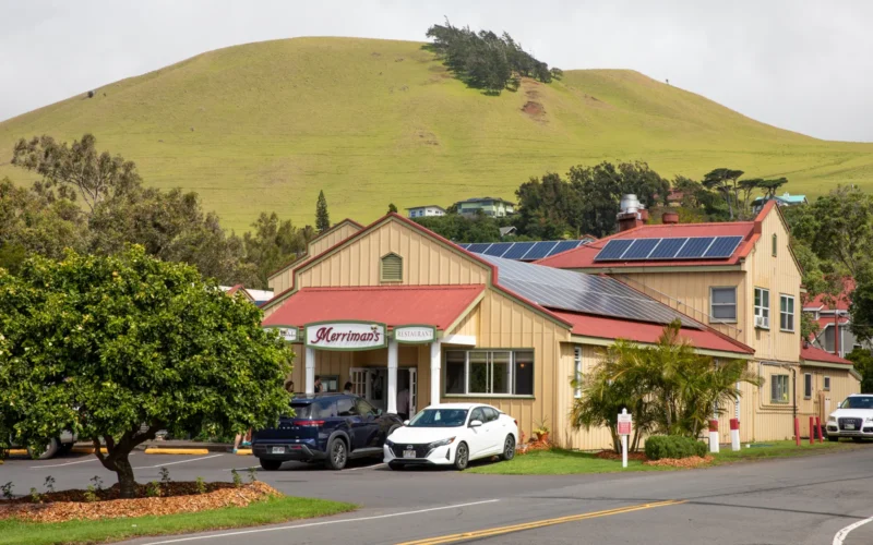 Storefronts and green hills in Waimea town on Hawaiʻi Island